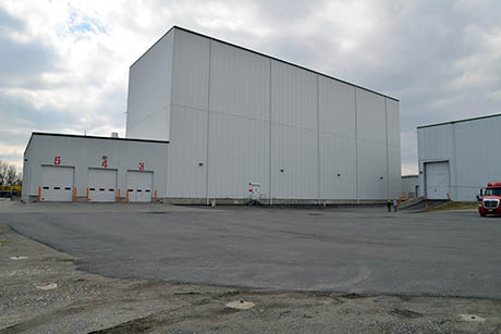 57 Citrosuco Port of Wilmington DE exterior of NFC tank farm with a tiny Geoff and Brian