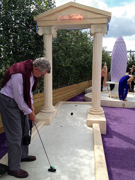 Dad playing Bompas and Parr minigolf