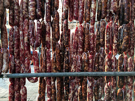 Sausages hanging on street 460