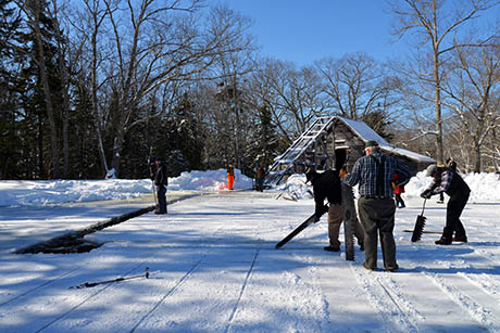 21 Sawing first blocks ice house in background